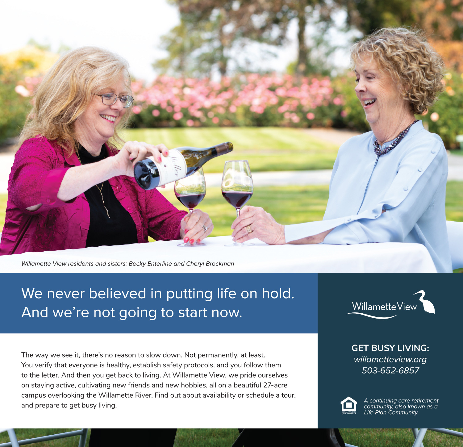 Image of two women - Willamette View residents and real-life sisters - sitting outside and enjoying a bottle of wine together.