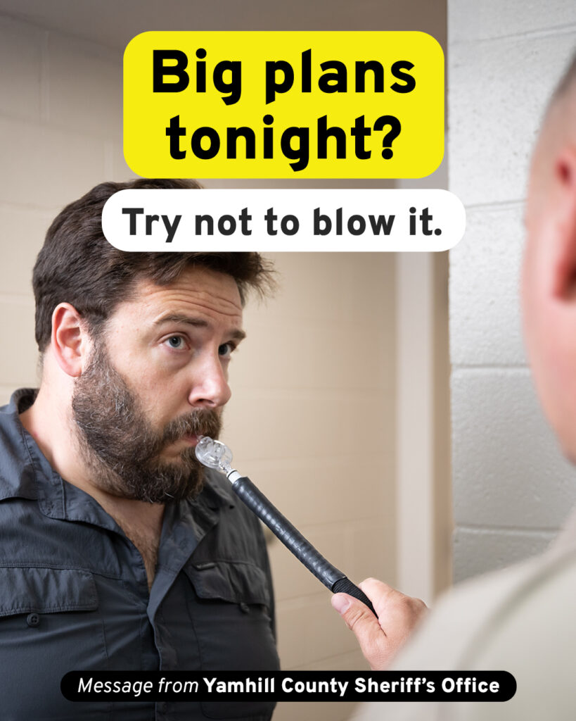 Picture of a man in his 40s at a police station. He is blowing in to a breathalyzer being held by a police officer. Text is overlaid on the image and reads - Big plans tonight? Try not to blow it. Message from Yamhill County Sheriff's Office.