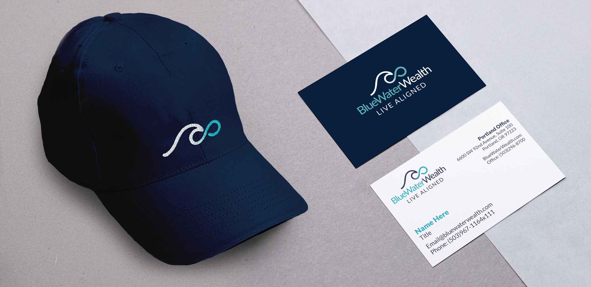 Blue Water Wealth business cards and a navy blue baseball cap